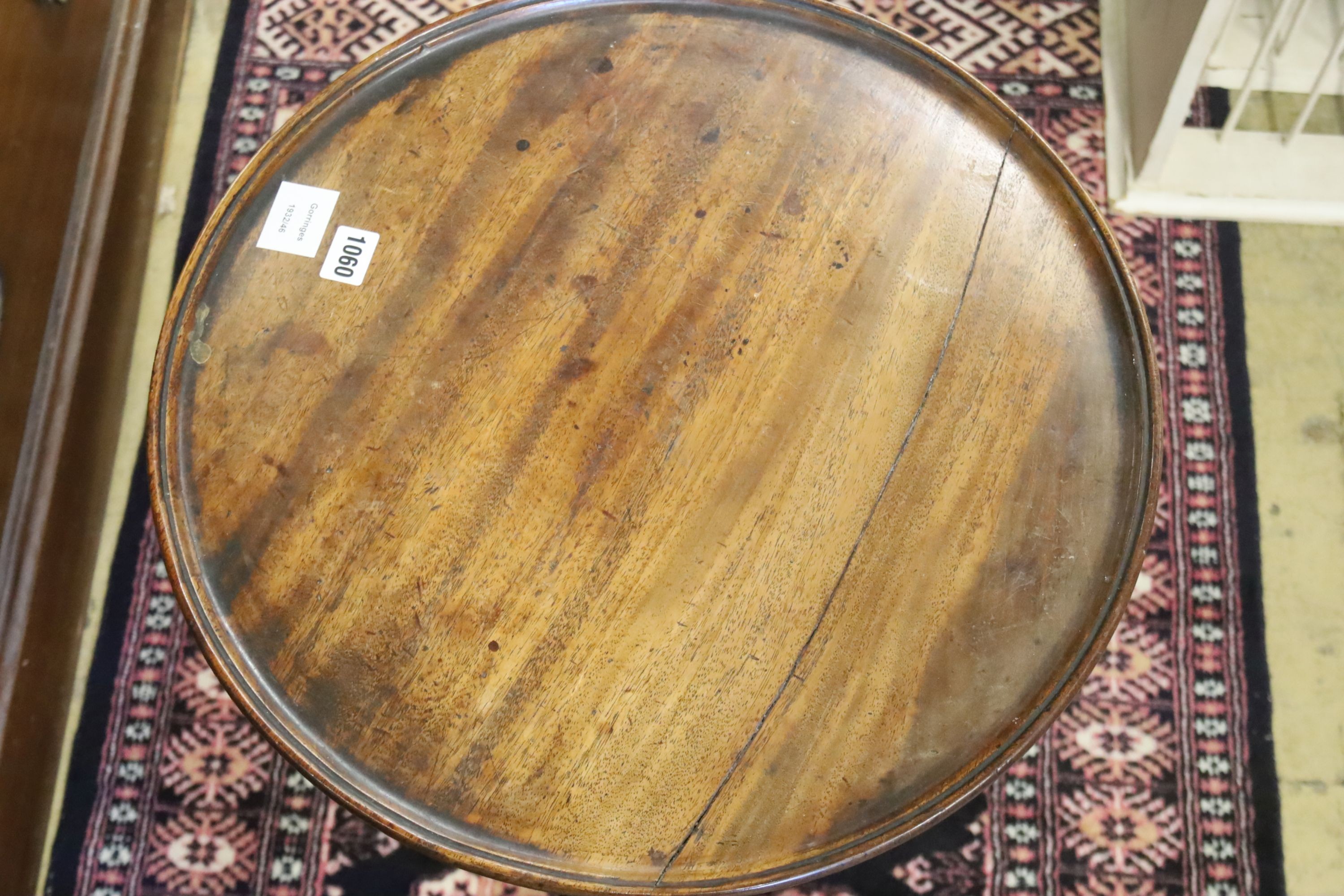 A George III mahogany dish topped wine table on tripod base, diameter 49cm, height 68cm